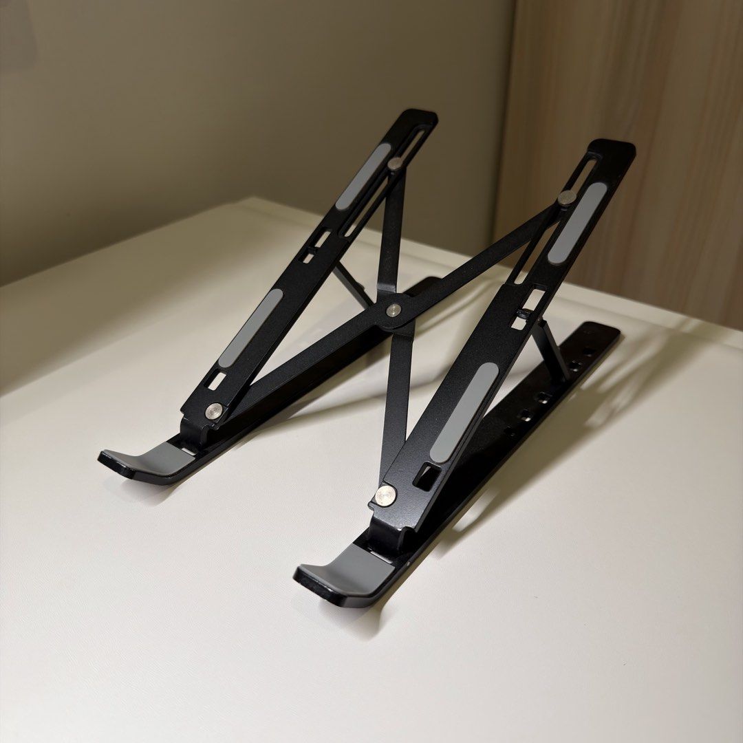 Adjustable foldable portable laptop stand (Category: Laptop Bags & Sleeves) located in Quezon City. Submitted by aj.mnl (Listing ID 1471090968, Image 2). Description: .