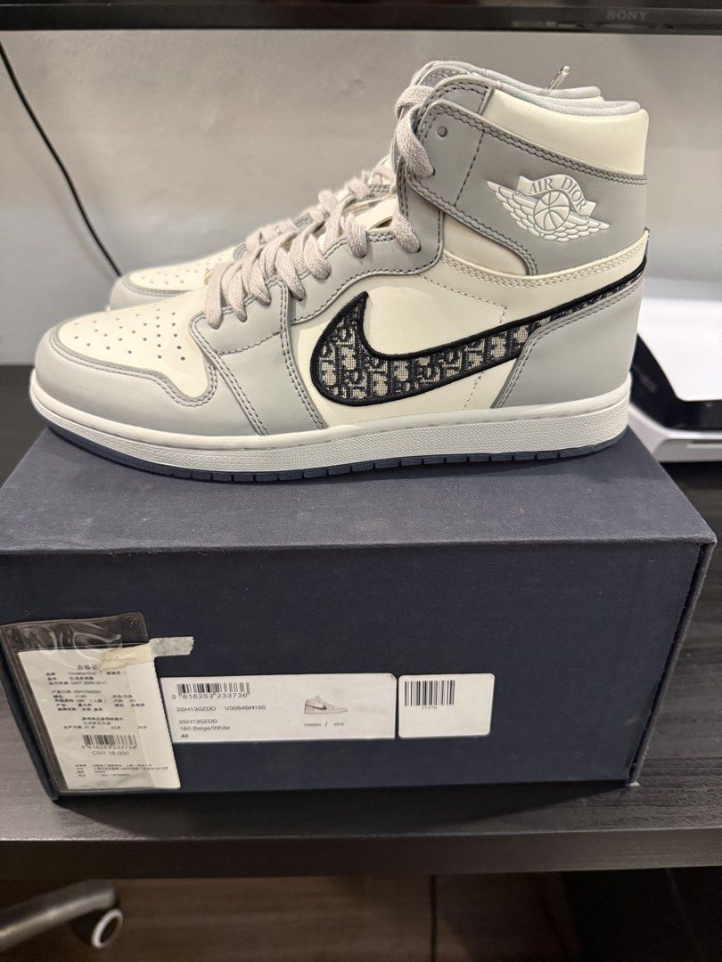 Air Jordan 1 High OG Dior (Category: Sneakers) located in Pasay City. Submitted by danmacaraeg (Listing ID 1471085582, Image 2). Description: - Model: Air Jordan 1 High OG Dior Collaboration - Size: US 11 / EU 45 - Condition: Brand new, completely unworn in crisp condition - Limited Edition: Individually numbered 3658 out of 8500 on the inner collar tab - Design: Premium white and grey leather upper featuring the iconic Dior Oblique jacquard Swoo