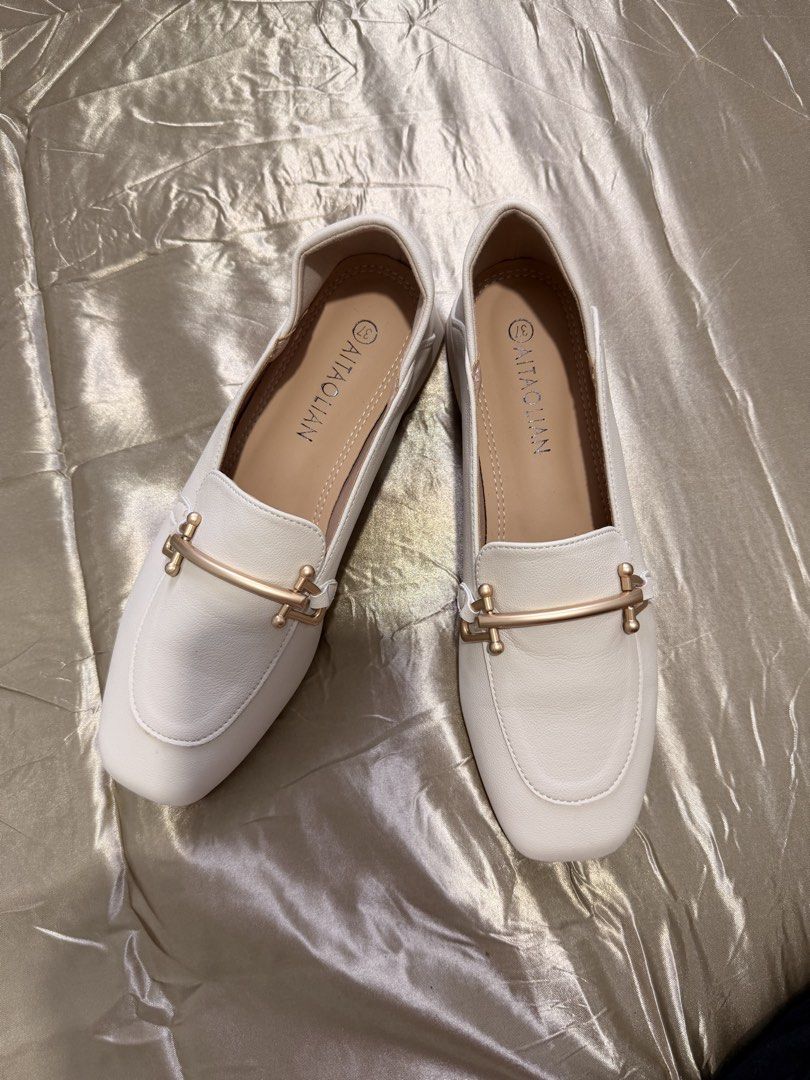 Aitaolian White Loafers Square Toe Size 37 (Category: Loafers) located in Baguio. Submitted by nabiwuh.06 (Listing ID 1471019430, Image 2). Description: - From Taiwan - Not my style and size - Original -Style: Square toe loafers with chic gold-tone hardware - Color: Classic white with a smooth synthetic leather finish - Heel: Comfortable low block heel for all-day wear - Size: 37 (stamped inside and on the sole) - Condition: Clean with pristine, 