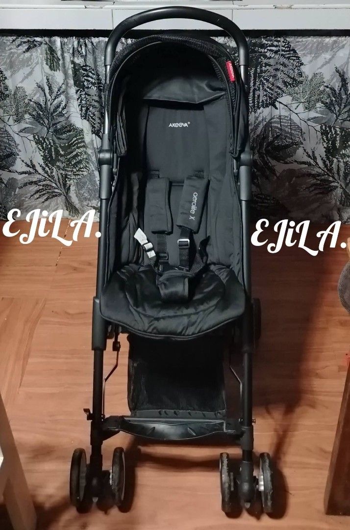 Akeeva Aerolite X Baby Stroller (Category: Strollers) located in Las Pinas. Submitted by liveflower_ab46a2 (Listing ID 1470984774, Image 3). Description: - Model: Akeeva Aerolite X baby stroller in solid black - Design: Compact foldable design with multi-wheel mobility and overhead canopy - Comfort & Safety: Comfortable padded seat with adjustable safety harness straps - Extras: Includes matching black travel backpack bag for easy transport - Con