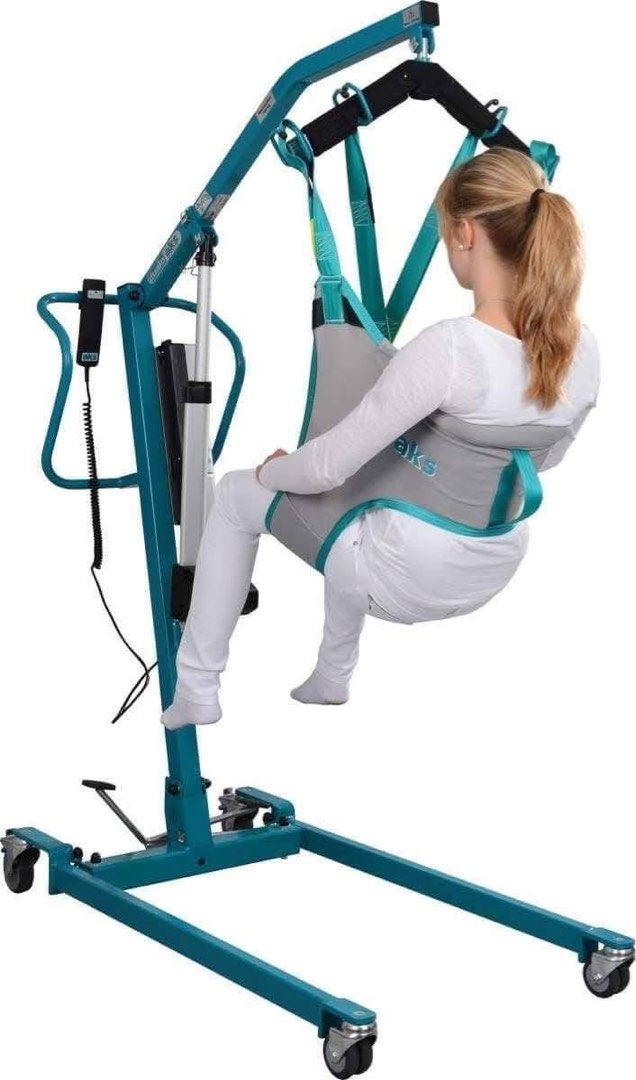 AKS Patient Lift Mobility Hoist (Category: Medical Supplies & Tools) located in Manila. Submitted by calmdolphin.87b0e4 (Listing ID 1470954903, Image 3). Description: - Color: Teal blue frame - Power: Electric actuator with handheld controller and rechargeable battery - Mobility: Heavy-duty locking caster wheels for safety - Inclusions: Padded sling included - Condition/Stock: Brand new/Multiple units available in storage - Ideal for: Safe patien