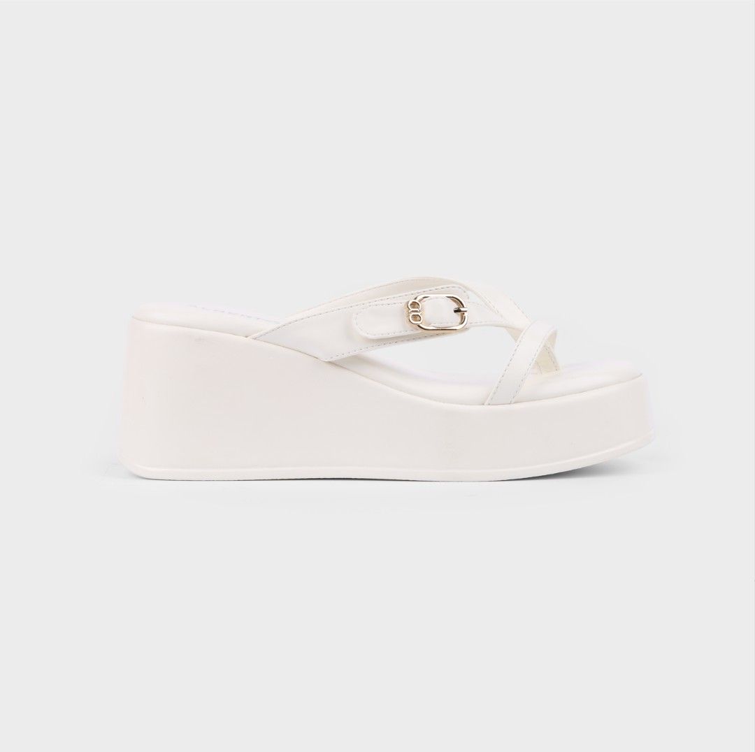Alberto White Platform Wedge Sandals (Category: Wedges) located in Manila. Submitted by sarah_200130 (Listing ID 1471023162, Image 2). Description: - Brand: Alberto - Style: Thong strap platform wedge sandals with side buckle detail - Color: White - Heel: Chunky heel for added height and stability - Inclusion: Original shoebox included - Mode of Payment: GCash, BPI, or COD via Shopee/Lazada checkout - Shipping: Via J&T Express (Buyer shoulders sh