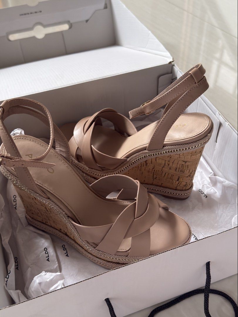 Aldo Nude Wedge Sandals with Box (Category: Wedges) located in Mabalacat. Submitted by mykachika (Listing ID 1471043689, Image 2). Description: - Brand: Aldo - Style: Nude wedge sandals with open toe and strappy design - Features: Cork-style heel and trendy braided chain trim detail - Closure: Buckle ankle closure - Condition: Once used for graduation - Inclusions: Comes in the original white shoe box with tissue paper.