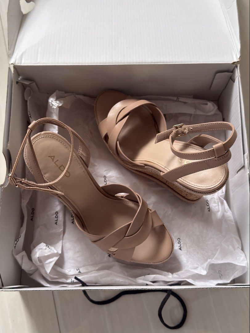 Aldo Nude Wedge Sandals with Box (Category: Wedges) located in Mabalacat. Submitted by mykachika (Listing ID 1471043689, Image 3). Description: - Brand: Aldo - Style: Nude wedge sandals with open toe and strappy design - Features: Cork-style heel and trendy braided chain trim detail - Closure: Buckle ankle closure - Condition: Once used for graduation - Inclusions: Comes in the original white shoe box with tissue paper.