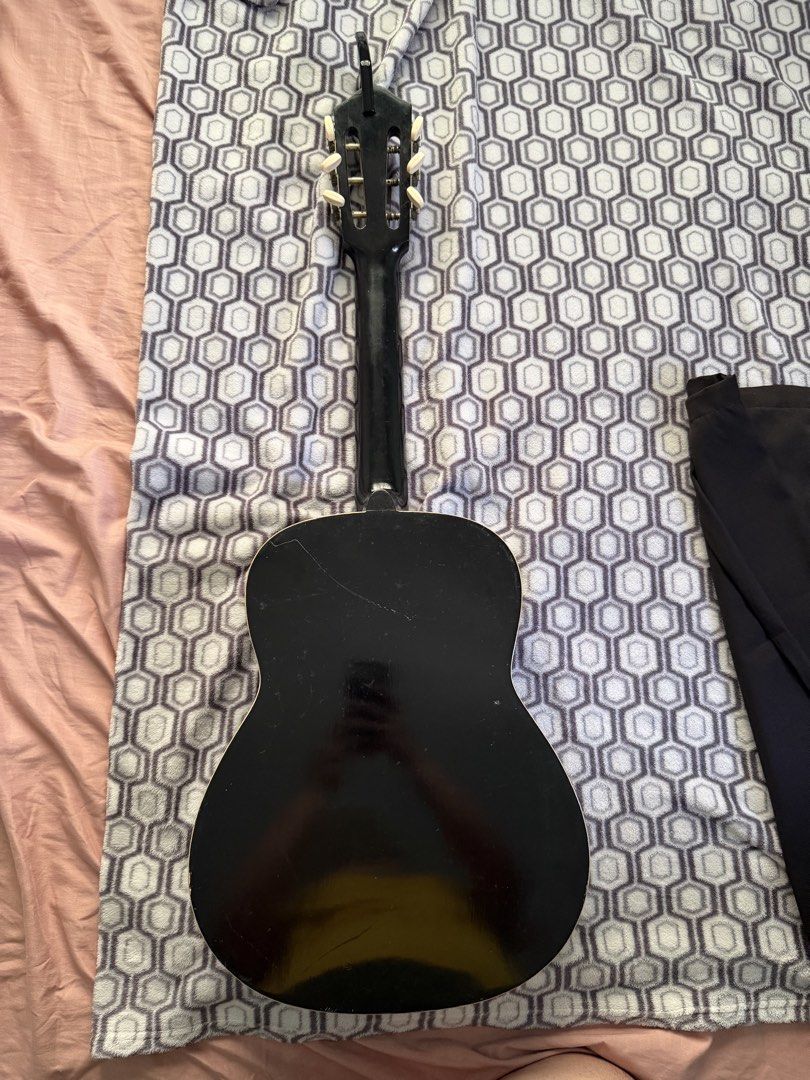 Alegre vintage acoustic guitar (Category: Musical Instruments) located in Malolos. Submitted by jaizemndz22 (Listing ID 1471114570, Image 3). Description: - Type: Nylon-string acoustic guitar - Finish: Sunburst top with black back and sides - Hardware: Classical tuning pegs, decorative soundhole rosette - Condition: Sold as-is for parts or repair - Flaws: Noticeable side body seam separation near the bottom edge, with general scuffs and surface w