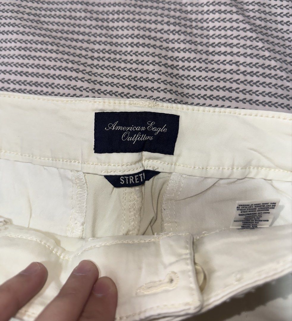 American Eagle Outfitters White Stretch Shorts (Category: Shorts) located in Santa Ana. Submitted by fatikilla (Listing ID 1470981382, Image 2). Description: - Brand: American Eagle Outfitters - Color: Classic White - Condition: Brand new with tags still attached - Material: Comfortable stretch fabric - Design: Front pockets, single button closure with zipper fly, and stylish folded hems - Style: Versatile everyday summer staple.