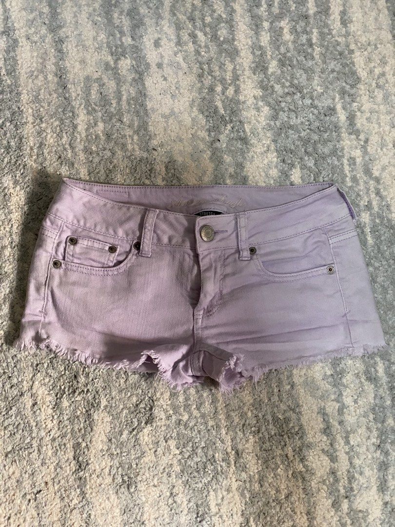 American Eagle Purple Stretch Denim Shorts (Category: Shorts) located in Manila. Submitted by kuya_moto (Listing ID 1470990291, Image 1). Description: - Brand: American Eagle - Color: Light purple - Fit: Low rise with comfortable stretch fabric - Details: Frayed raw hem, branded metal button closure, and leather patch on back waistband - Special Feature: Charming white lace applique on back pockets - Shipping: Ships fast from the Philippines via 
