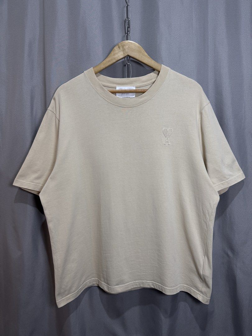 Ami Beige Tonal Logo Tee (Category: Tshirts & Polo Shirts ) located in Meycauayan. Submitted by itstimothrifts (Listing ID 1471009645, Image 2). Description: Ami Beige Tonal Logo Tee Excellent Condition Authentic No flaws M on tag fits L W 23.5 L 27 .