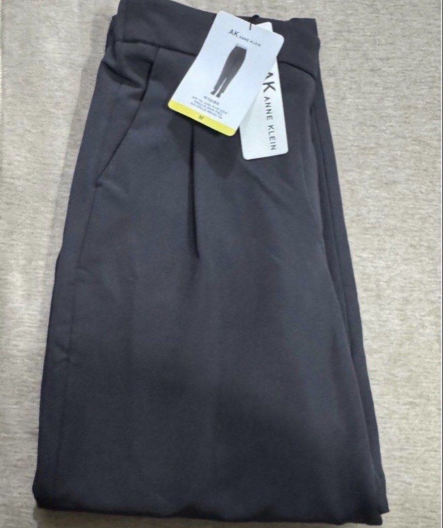 Anne Klein AK Dark Grey Pants Size M (Category: Other Bottoms) located in Pasay City. Submitted by szepter (Listing ID 1470952630, Image 1). Description: - Brand: Anne Klein - Size: M (Dark Grey) - Condition: Brand new with original tags attached - Comfort: Smooth fabric with an elastic waistband at the back - Details: Front pleats near pockets and two spacious back pockets - Versatility: Perfect for daily wear or office outfits.