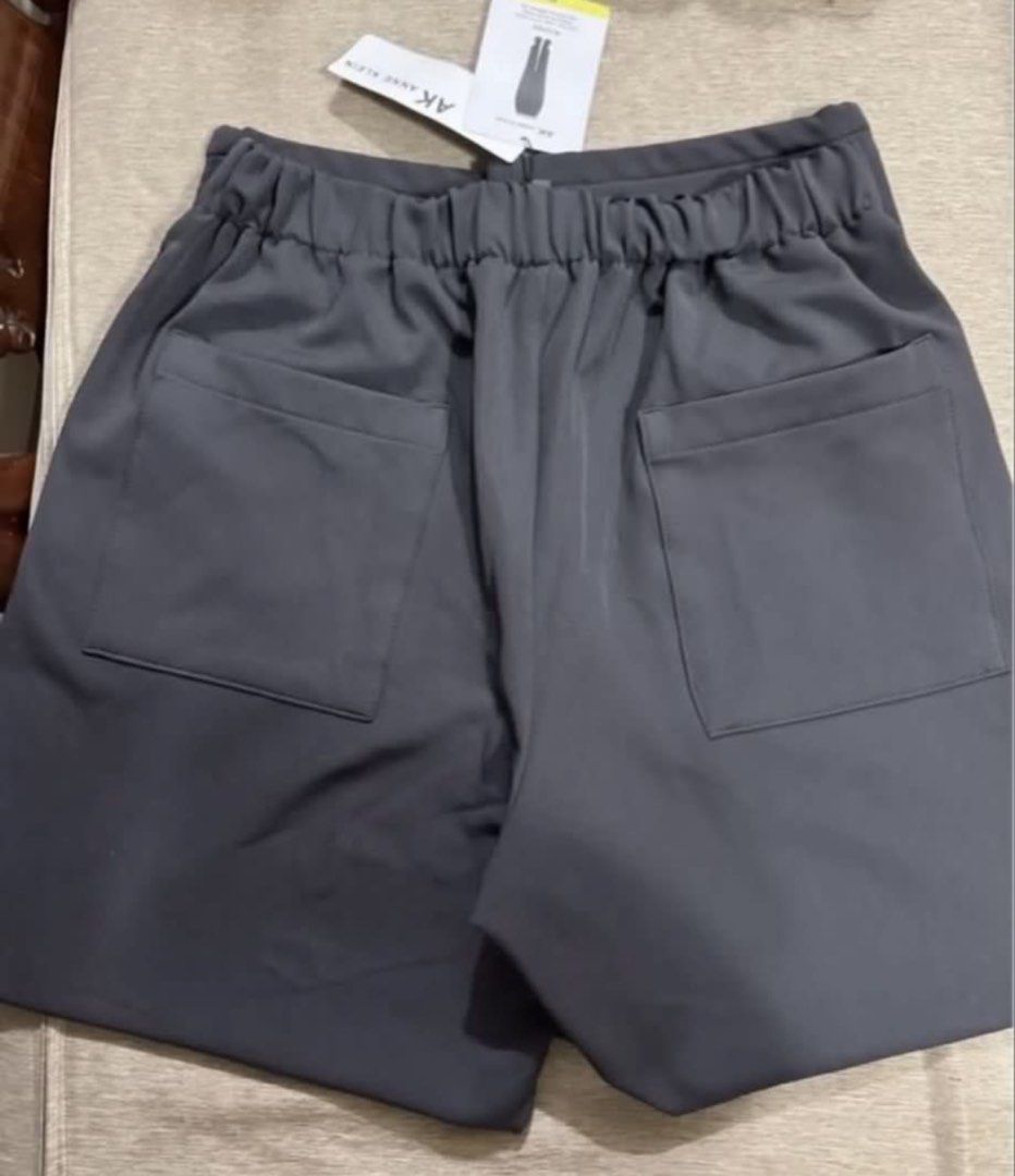 Anne Klein AK Dark Grey Pants Size M (Category: Other Bottoms) located in Pasay City. Submitted by szepter (Listing ID 1470952630, Image 3). Description: - Brand: Anne Klein - Size: M (Dark Grey) - Condition: Brand new with original tags attached - Comfort: Smooth fabric with an elastic waistband at the back - Details: Front pleats near pockets and two spacious back pockets - Versatility: Perfect for daily wear or office outfits.