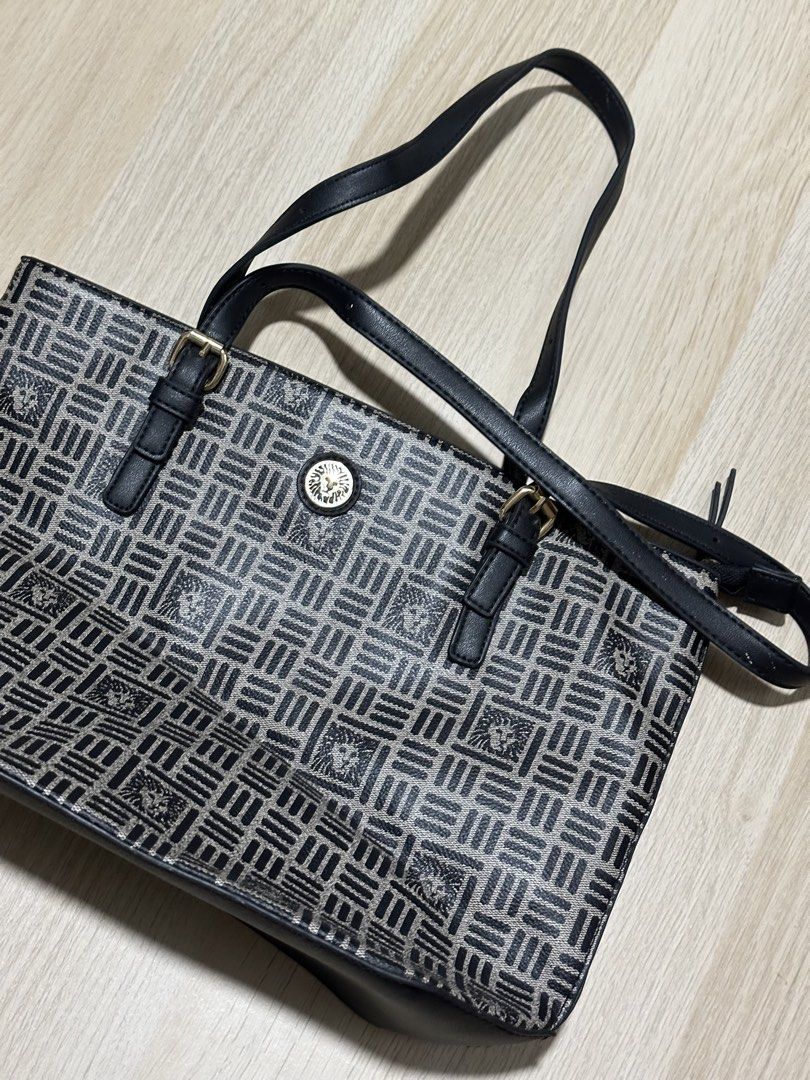 Anne Klein Monogram Print Shoulder Bag (Category: Shoulder Bags) located in Mandaluyong City. Submitted by supercleng (Listing ID 1471075616, Image 3). Description: - Brand: Anne Klein - Color/Design: Black and grey patterned fabric with black faux leather trim - Hardware: Gold-tone front logo emblem - Interior: Clean beige lining with a convenient zipper pocket - Condition: Excellent, clean inside and out.