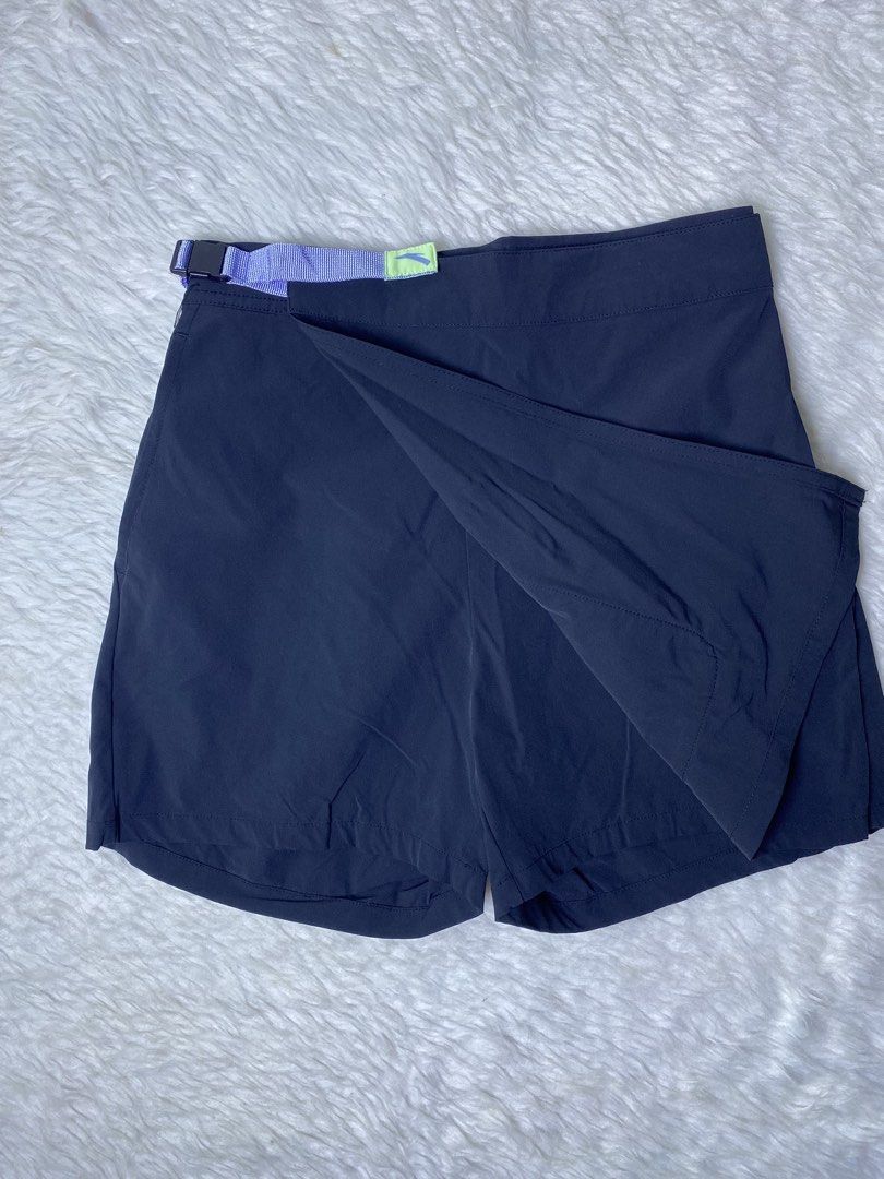 ANTA ADV Utility Trail Hiking Skort (Category: Activewear) located in Quezon City. Submitted by getgetpao (Listing ID 1470954893, Image 3). Description: Size on tag (cut) 14”Lx26”-29”W Leg hole 10” Issue: cut tag and loose stitch (see photos) Washed. Very good condition - Color: Black with purple, blue, and neon green accents - Design: Wrap-around front panel with built-in shorts underneath - Features: Light purple and blue patterned webbed belt 