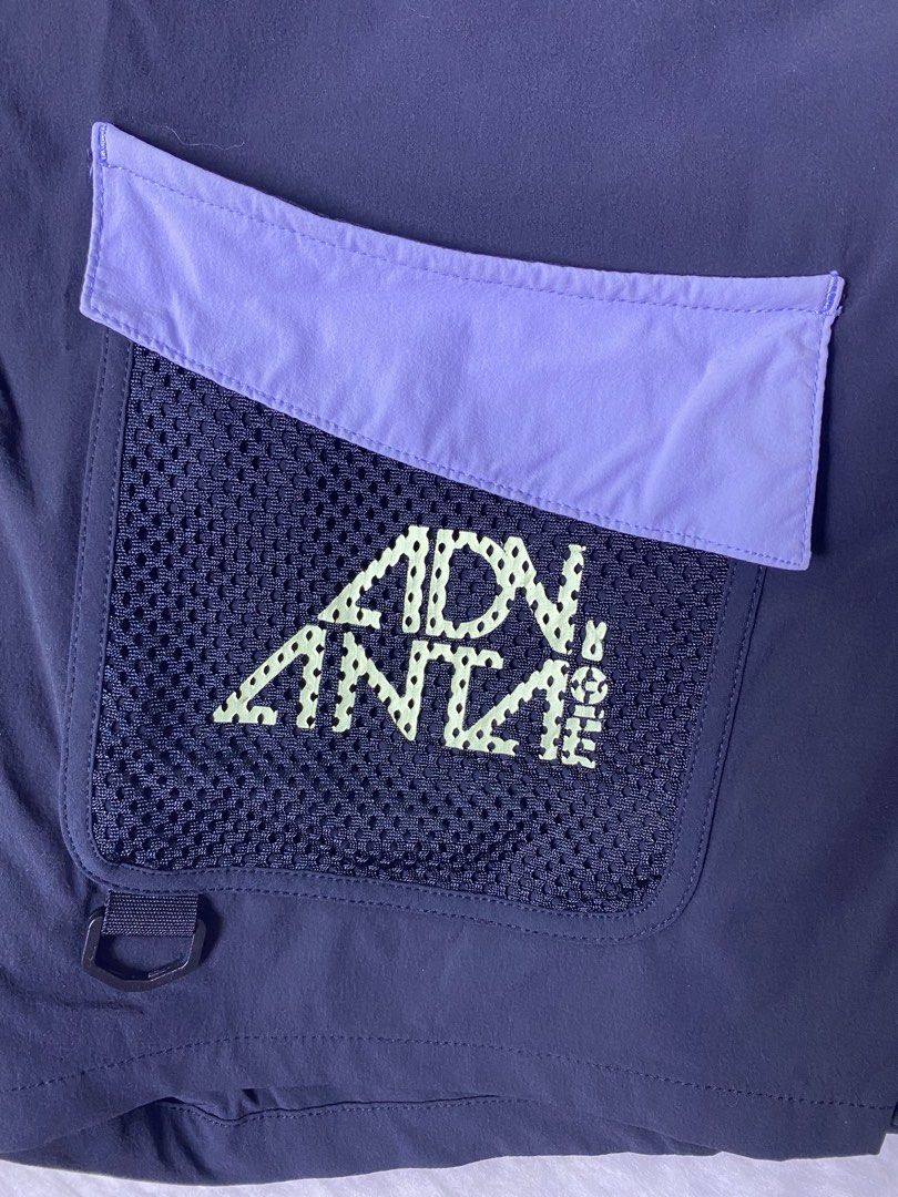 ANTA ADV Utility Trail Hiking Skort (Category: Activewear) located in Quezon City. Submitted by getgetpao (Listing ID 1470954893, Image 2). Description: Size on tag (cut) 14”Lx26”-29”W Leg hole 10” Issue: cut tag and loose stitch (see photos) Washed. Very good condition - Color: Black with purple, blue, and neon green accents - Design: Wrap-around front panel with built-in shorts underneath - Features: Light purple and blue patterned webbed belt 