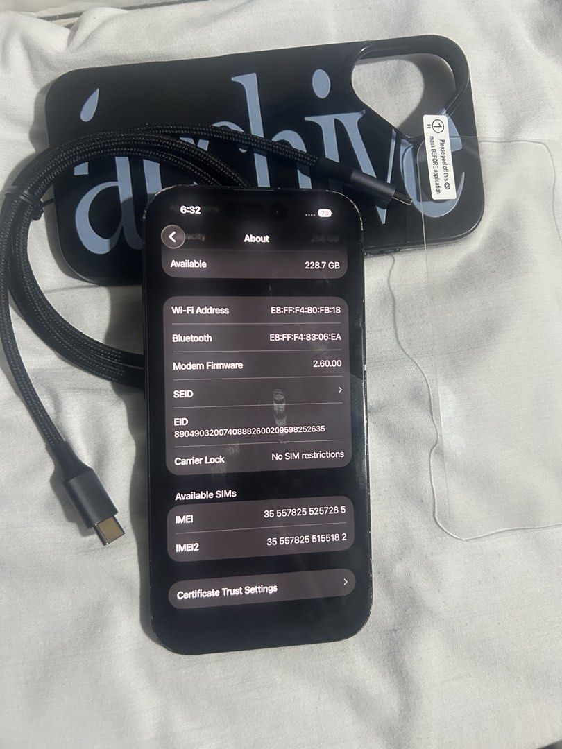 Apple iPhone 16 256GB Black Unlocked (Category: iPhone 16 Series) located in Manila. Submitted by maryclaire61487 (Listing ID 1471035083, Image 2). Description: - Model: Apple iPhone 16 (MYEE3ZP/A, Serial: FNX33GFNW) - Storage: 256GB - Color: Black - Condition: Fully functional, with visible scuffs and wear along the edges and housing frame - Network: Factory unlocked (no SIM restrictions) - Inclusions: Charging cable, black text phone case, and 