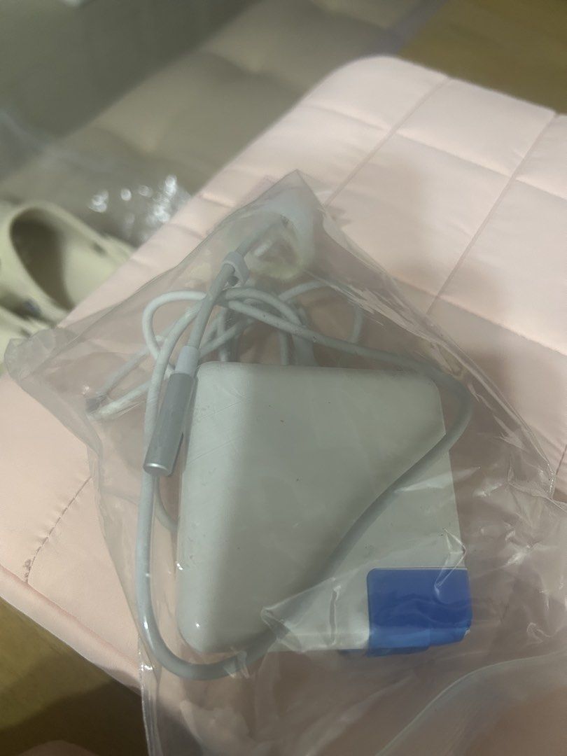 Apple MagSafe 1 Power Adapter (Category: Chargers & Cables) located in Manila. Submitted by cfsg061214 (Listing ID 1471075756, Image 2). Description: It is generally associated with older MacBooks, including some: MacBook (13-inch, 2006–2010) MacBook Pro (13-inch, 2009–2012) MacBook Air (certain models) - Genuine white power brick with attached cable - Magnetic DC connector plug (blue tape on casing) - Clean housing with zero scratches - Cord is 