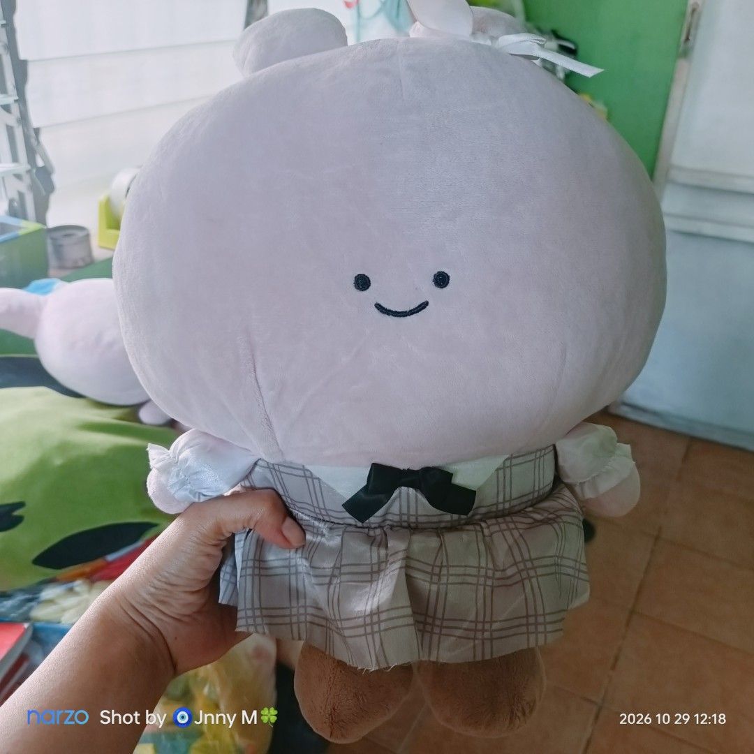 ASAMIMI Plush Toys Set (Category: Plushies & Soft Toys) located in Taguig. Submitted by mhayestufftoys (Listing ID 1470968247, Image 2). Description: - Set of 2 adorable pink plush dolls - Doll 1: Wears a grey plaid dress with a black bow, white collar, and a cute white hair bow - Doll 2: Features a blue hat/scarf detail with closed embroidered eyes and a smiling expression - Made with ultra-soft, huggable fabric - Perfect size for cuddling and d