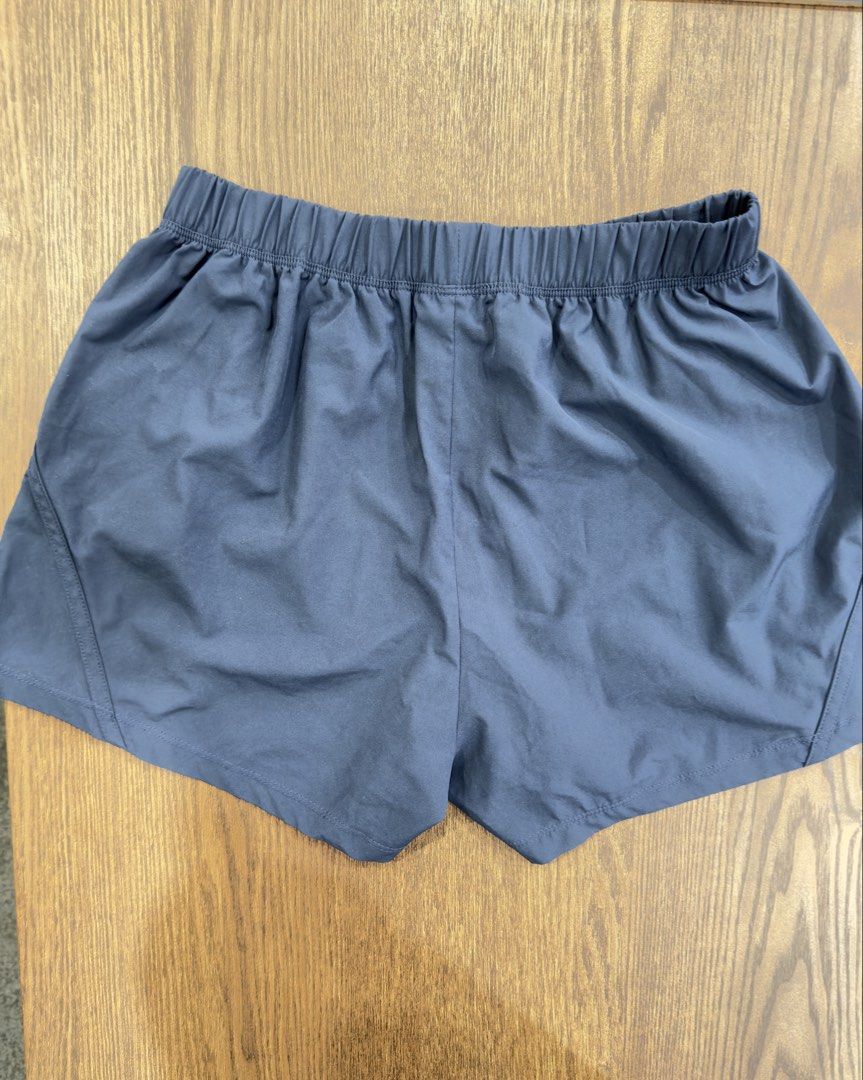 Asics Running Shorts Navy Blue Size S (Category: Activewear) located in Angeles City. Submitted by beyond.this (Listing ID 1470982150, Image 2). Description: - Brand: Asics - Color: Navy Blue - Size: Small - Material: Lightweight, quick-drying polyester - Features: Elastic waistband with comfortable stretch and Asics logo on lower left leg - Condition: Great workout gear with clean interior care tag - Origin: Made in China.