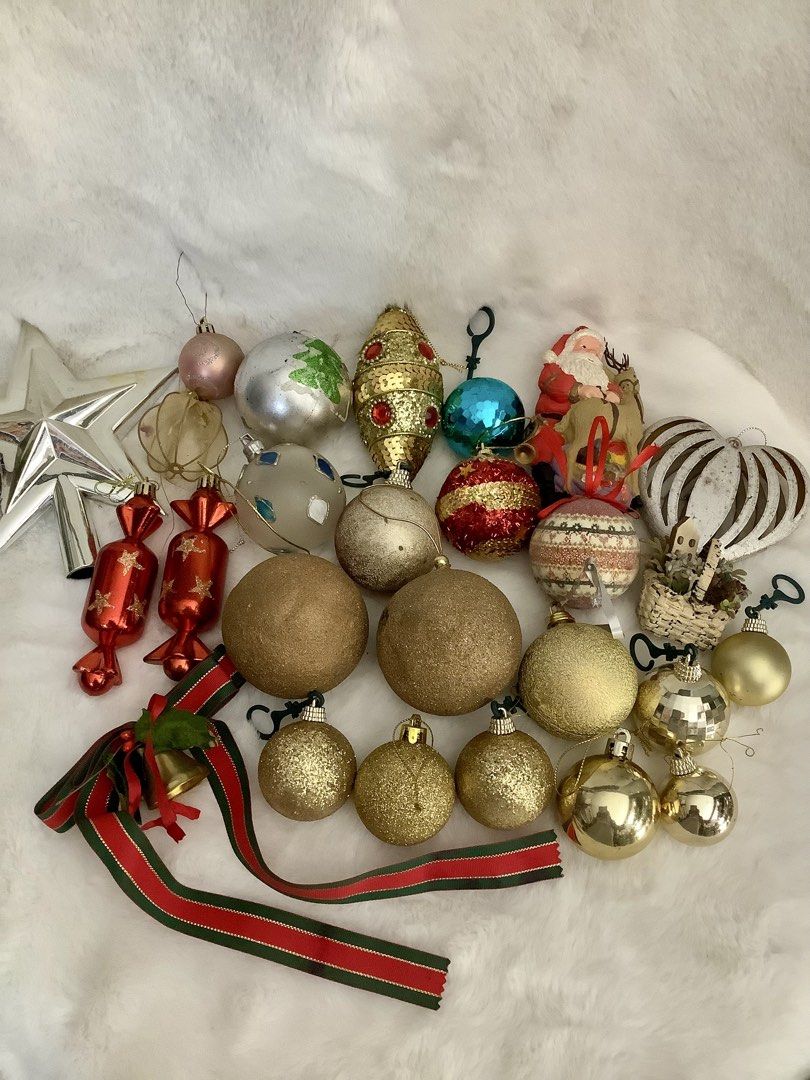 Assorted Christmas Ornaments Tree Decor Set (Category: Vintage Collectibles) located in Quezon City. Submitted by heybailey (Listing ID 1470970595, Image 1). Description: - Large holiday decoration bundle for whole-tree setup or adding to existing decor - Includes shiny gold balls, glitter baubles, and red candy-shaped ornaments - Features a silver tree topper star, a festive Santa figurine, and matching ribbon - Mixed styles and varied sizes - S