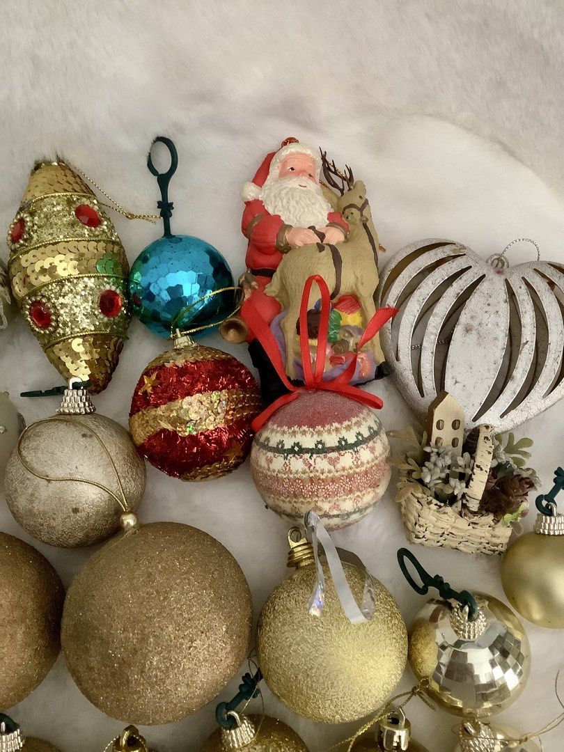 Assorted Christmas Ornaments Tree Decor Set (Category: Vintage Collectibles) located in Quezon City. Submitted by heybailey (Listing ID 1470970595, Image 3). Description: - Large holiday decoration bundle for whole-tree setup or adding to existing decor - Includes shiny gold balls, glitter baubles, and red candy-shaped ornaments - Features a silver tree topper star, a festive Santa figurine, and matching ribbon - Mixed styles and varied sizes - S