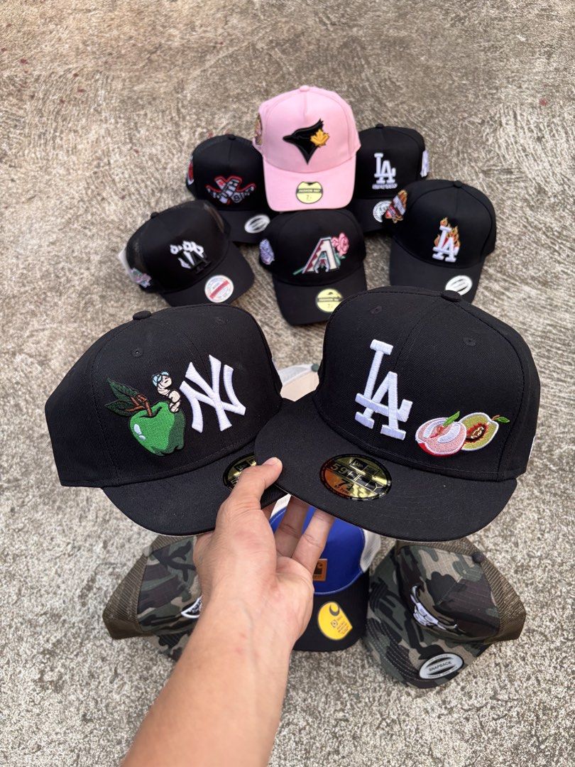 Assorted MLB Fitted and Snapback Caps (Category: Caps & Hats) located in Kalamansig. Submitted by jamesthrifted (Listing ID 1471058730, Image 2). Description: - Massive hat collection: NY Yankees, LA Dodgers, Chicago Bulls, Las Vegas Raiders, & Arizona Diamondbacks - Styles: Fitted 59FIFTY and adjustable mesh snapbacks - Unique details: Special side embroidery including apples, roses, and flames - Perfect for daily streetwear fits and cap collect
