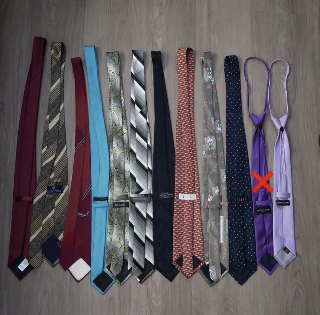 Assorted Neckties Lot Designer Brands Various Styles (Category: Ties) located in Manila. Submitted by mixi_lexi (Listing ID 1471043890, Image 2). Description: - Bundle of assorted designer neckties (Givenchy, Brioni, Perry Ellis, Pierre Cardin) - Variety of patterns: stripes, paisley, polka dots, and novelty prints - Colors include burgundy, teal, green, grey, navy, red, purple, and lavender - Standard lengths and widths - Ideal for work, formal 