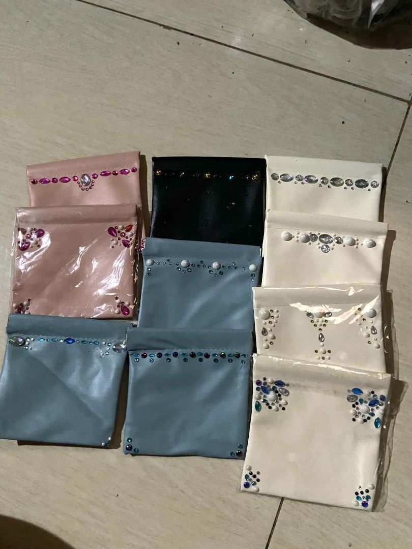 Assorted Rhinestone Embellished Small Pouches Bags (Category: Purses & Pouches) located in Zaragoza. Submitted by sherree1281 (Listing ID 1470932414, Image 1). Description: - Colors: Pastel Pink, Black, Grey, and Cream - Design: Unique rhinestone and faux pearl patterns on the front - Material: Soft faux leather with a secure snap closure - Function: Ideal for organizing small accessories inside a bigger bag - Condition: Brand new (some still sea