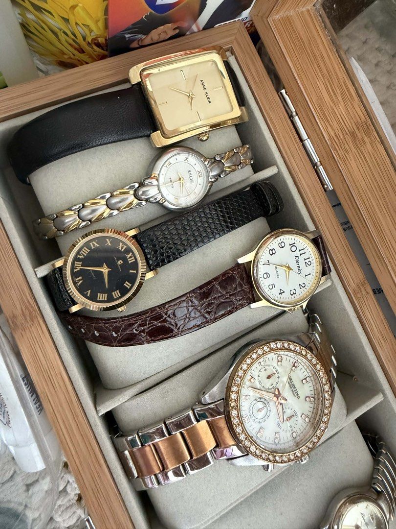 Assorted Women's Wristwatch Collection (Category: Women's Watches) located in Bacoor. Submitted by missleahloy (Listing ID 1471038065, Image 1). Description: - Collection of 5 stylish women's wristwatches stored in a convenient wooden box - Anne Klein gold square watch with a black leather band - Relic two-tone bracelet watch - Gold-tone watch with a black Roman numeral dial and textured black leather strap - Eternity white dial watch with a brow