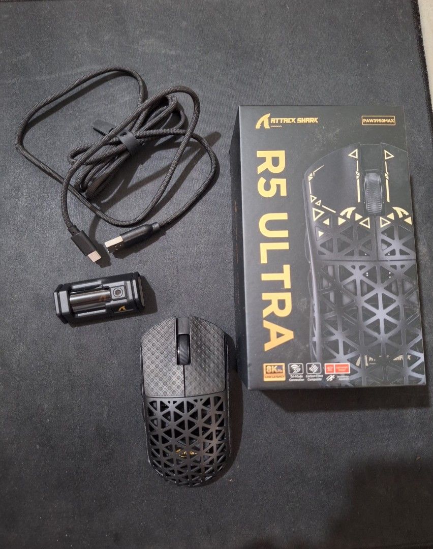 Attack Shark R5 Ultra Gaming Mouse (Category: Mouse & Mousepads) located in Manila. Submitted by curt06 (Listing ID 1471072309, Image 1). Description: - Model: Attack Shark R5 Ultra Wireless Gaming Mouse - Color: Black - Sensor: Flagship PAW3950MAX sensor for pinpoint accuracy - Performance: Supports ultra-fast 8K polling rate - Build: Lightweight and durable carbon fiber composite body - Connectivity: Tri-mode connection (Bluetooth, 2.4GHz wirel