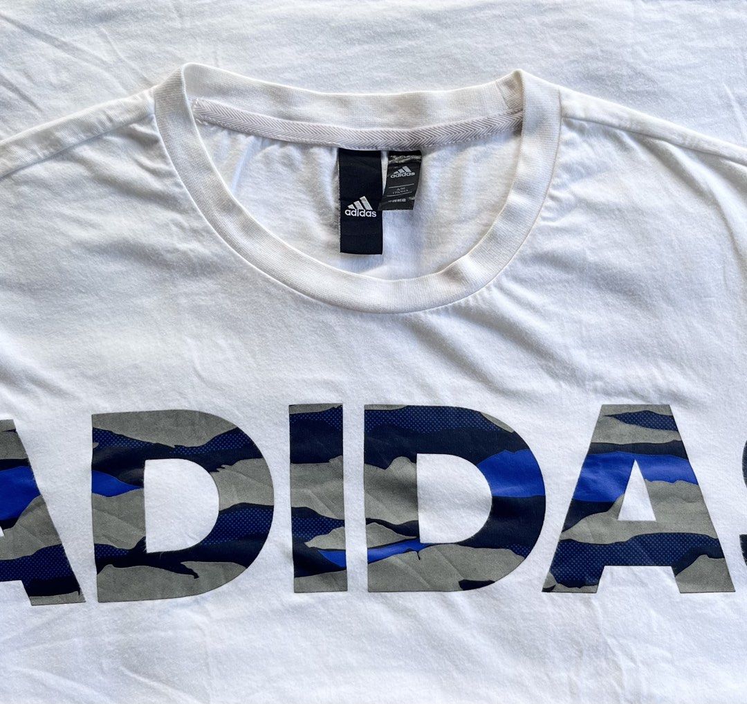 Authentic Adidas Camo-Print Big Logo Tee (Category: Tshirts & Polo Shirts ) located in Maddela. Submitted by ronb.tp (Listing ID 1471032840, Image 2). Description: Absolutely no issues / No flaws 💯 Dimes: • Width: 19 inches • Length: 26 inches Size: Fits Medium to Large.