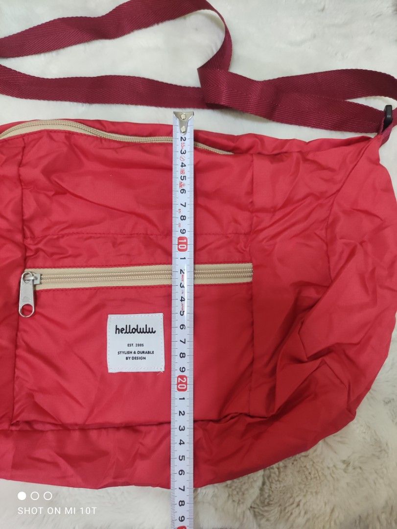 Authentic Hellolulu Red Packable Travel Boston / Crossbody Bag (Category: Cross-body Bags) located in Cavite. Submitted by dextermanalo28 (Listing ID 1471054797, Image 2). Description: Authentic Hellolulu Red Packable Travel Boston / Crossbody Bag.