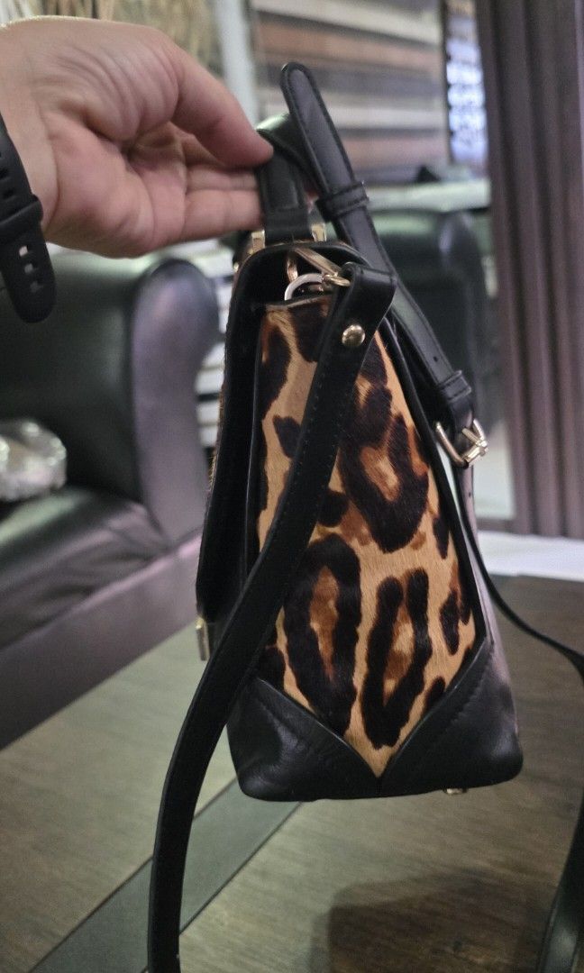 Authentic Kate Spade handbag (Category: Cross-body Bags) located in Apalit. Submitted by mjtwicedstyle_de_ap (Listing ID 1470978996, Image 2). Description: preloved Authentic Kate Spade handbag with provided sling in very good condition with normal signs of usage only leather/calf hair may rubs s calf hair s backpart,but not noticeable when worn ok pa rn nmn pls see photos.