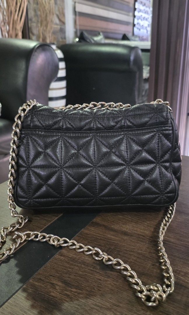 Authentic Kate Spade quilted sling bag (Category: Luxury Bags & Wallets) located in Apalit. Submitted by mjtwicedstyle_de_ap (Listing ID 1470973198, Image 2). Description: preloved Authentic Kate spade quilted shoulder / sling bag leather material honest issue: fadings on the hardware as sign of usage. but no damage Interior needs cleaning leather is still in excellent condition. Selling for only 1700.