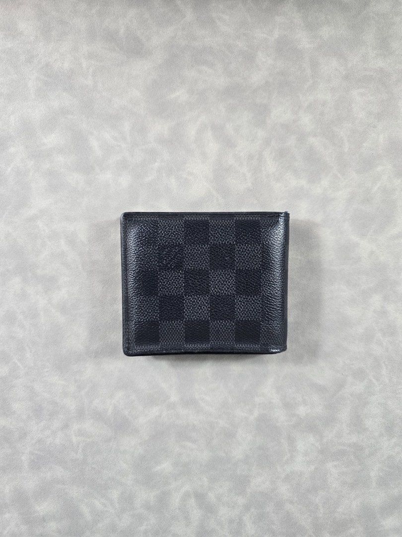 Authentic Louis Vuitton Graphite Bifold Wallet (Category: Luxury Bags & Wallets) located in Makati City. Submitted by luxchelry (Listing ID 1471059044, Image 2). Description: Graphite Bifold Wallet ♦️Comes with paperbag 🌟8.5/10 ♦️Any discoloration is due to lighting only. 🌟100% Authentic, Moneyback guarantee ✨️P6000✨️ 📍Makati Disclaimer: All product names, logos, brands and other trademarks or images shown mentioned are the property of the res