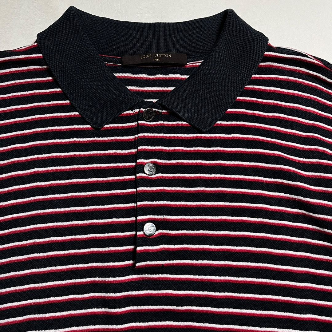 Authentic Louis Vuitton Striped Polo Shirt (Category: Tshirts & Polo Shirts ) located in Caloocan City. Submitted by achilles_grails (Listing ID 1471047687, Image 2). Description: - Brand: Louis Vuitton - Design: Navy blue, red, and white horizontal stripes - Features: Short sleeves, classic knit collar, branded button placket - Condition: Clean, ready to wear, with inner brand and care tags intact - Fit: Standard fit.
