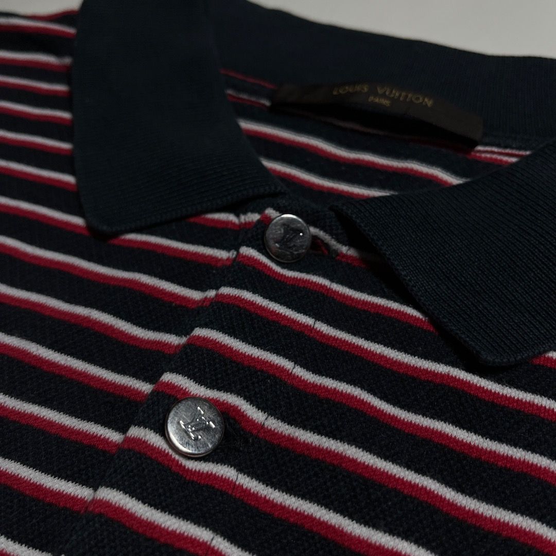 Authentic Louis Vuitton Striped Polo Shirt (Category: Tshirts & Polo Shirts ) located in Caloocan City. Submitted by achilles_grails (Listing ID 1471047687, Image 3). Description: - Brand: Louis Vuitton - Design: Navy blue, red, and white horizontal stripes - Features: Short sleeves, classic knit collar, branded button placket - Condition: Clean, ready to wear, with inner brand and care tags intact - Fit: Standard fit.