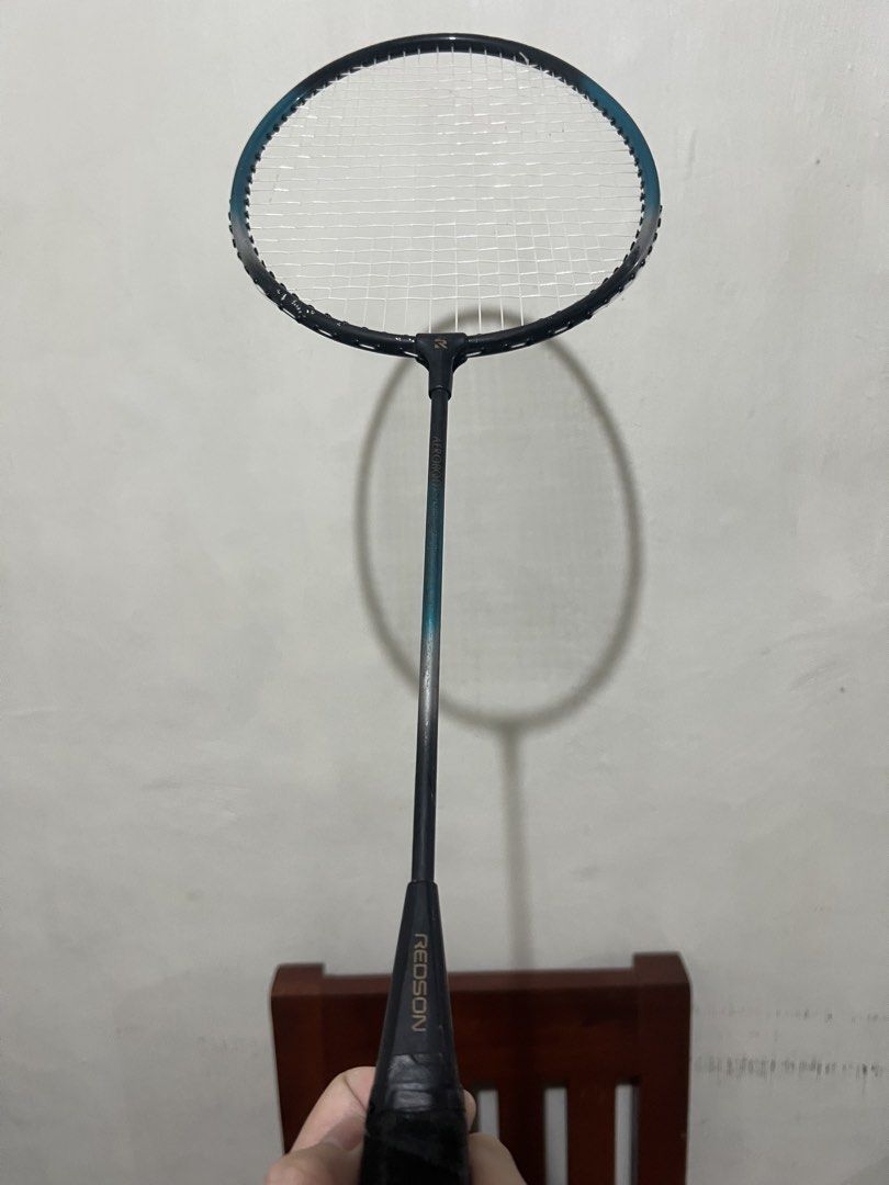 Authentic Redson Aerobody Badminton Racket (Used) (Category: Racket and Ball Sports) located in Manila. Submitted by ajd080324 (Listing ID 1471092166, Image 3). Description: Product Details: • Brand/Model: Redson Aerobody • Authenticity: 100% Original (features the Redson “R” logo end cap and cone branding) • Condition: 7/10. Shows noticeable paint chips around the frame loop (please check the photos for transparency). NO cracks or structural dam