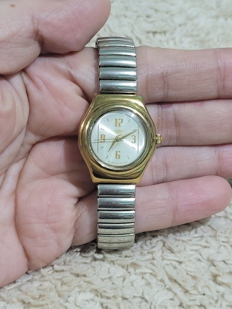 AUTHENTIC SWATCH IRONY LADY "Reverence" WATCH (Category: Luxury Watches) located in Makati City. Submitted by juriexpi (Listing ID 1470932388, Image 1). Description: AUTHENTIC SWATCH IRONY LADY "Reverence" WATCH - in very good working condition, authentic vintage Swatch Swiss watch, what you seet is what you get, fits small to medium wrist Model: Swatch Irony Lady "Reverence" Reference Code YSS104G Release Year 1996 (Fall/Winter Collection) Case 
