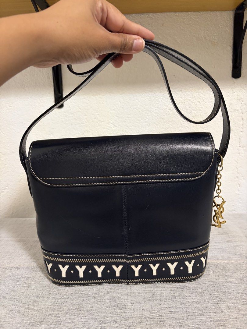 Authentic YSL Shoulder Bag (Category: Announcements) located in Paoay. Submitted by ysmattic (Listing ID 1470953521, Image 2). Description: 100% guaranteed authentic 1990’s Yves Saint Laurent shoulder bag in navy blue color. With YSL’s authenticity card. In excellent vintage condition. .