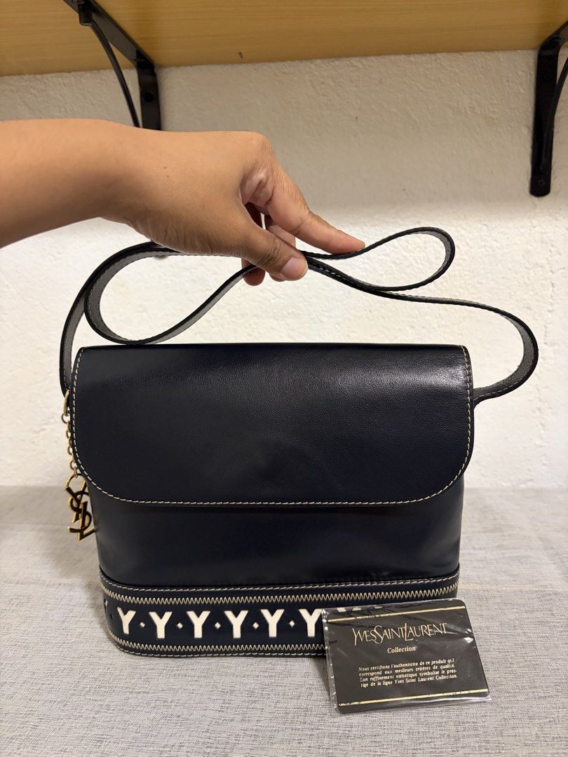 Authentic YSL Shoulder Bag (Category: Announcements) located in Paoay. Submitted by ysmattic (Listing ID 1470953521, Image 1). Description: 100% guaranteed authentic 1990’s Yves Saint Laurent shoulder bag in navy blue color. With YSL’s authenticity card. In excellent vintage condition. .