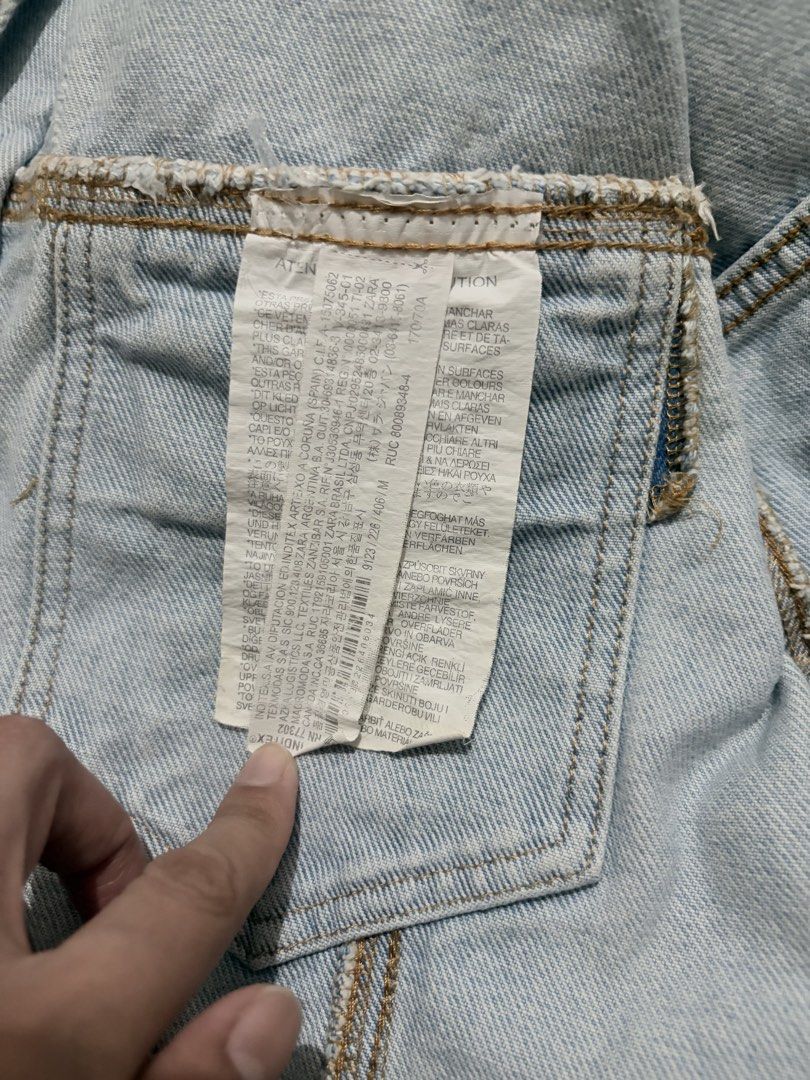 110. Authentic ZARA TRF Cropped Light Wash Denim Jacket (Category: Coats, Jackets and Outerwear) located in Manila. Submitted by athenabrave (Listing ID 1470983794, Image 3). Description: Brand: Zara (Authentic Denim by TRF) Size: Medium to Large Color: Light Wash Blue / Bleach Wash Description: Up for grabs is this trendy, aesthetic Zara TRF cropped denim jacket. It comes in a beautiful light wash finish with silver-toned hardware, dual chest po