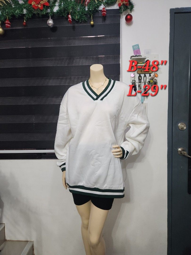 B-7 Preppy White V-Neck Pullover Sweater ✨ (Category: Coats, Jackets and Outerwear) located in Tanza. Submitted by wearitagainph (Listing ID 1471018280, Image 1). Description: Sporty, stylish, and super versatile! Features a crisp white fabric accented with classic dark green and white striped ribbed trim along the V-neck, cuffs, and hem—perfect for a preppy, varsity-inspired look. * Bust: 48" * Length: 29" * Color: White / Green Trim * Condition