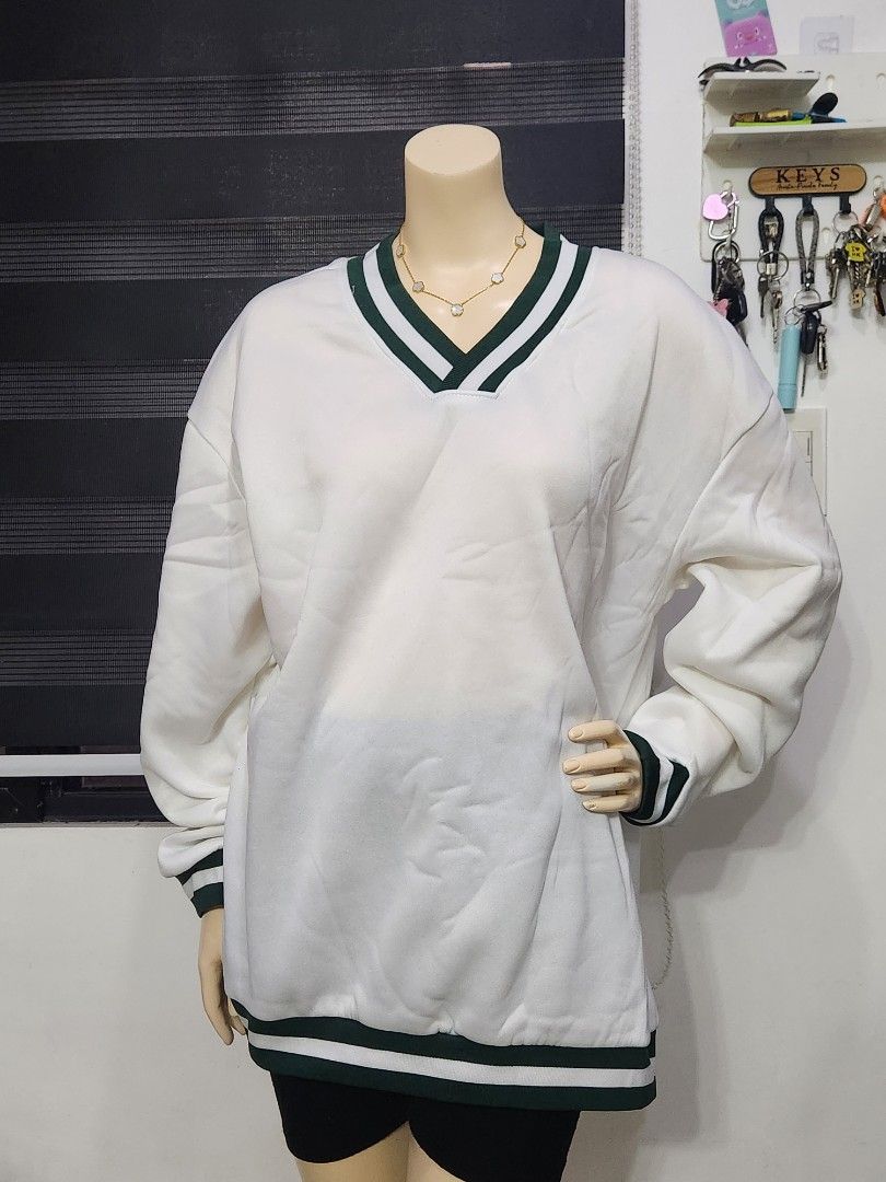 B-7 Preppy White V-Neck Pullover Sweater ✨ (Category: Coats, Jackets and Outerwear) located in Tanza. Submitted by wearitagainph (Listing ID 1471018280, Image 3). Description: Sporty, stylish, and super versatile! Features a crisp white fabric accented with classic dark green and white striped ribbed trim along the V-neck, cuffs, and hem—perfect for a preppy, varsity-inspired look. * Bust: 48" * Length: 29" * Color: White / Green Trim * Condition