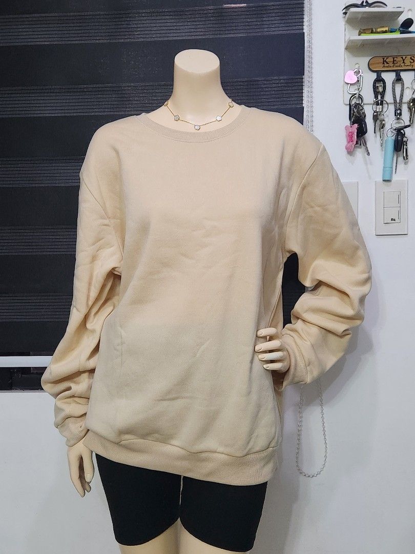 B-8 Classic Beige Crewneck Sweatshirt ✨ (L) (Category: Coats, Jackets and Outerwear) located in Tanza. Submitted by wearitagainph (Listing ID 1471019504, Image 3). Description: Cozy, minimal, and versatile! Features a classic crew neckline, ribbed cuffs and hem, and a relaxed, comfortable fit—a perfect wardrobe staple for effortless everyday wear. * Bust: 48" * Length: 27" * Color: Cream / Beige * Condition: Excellent DM to order or inquire!.