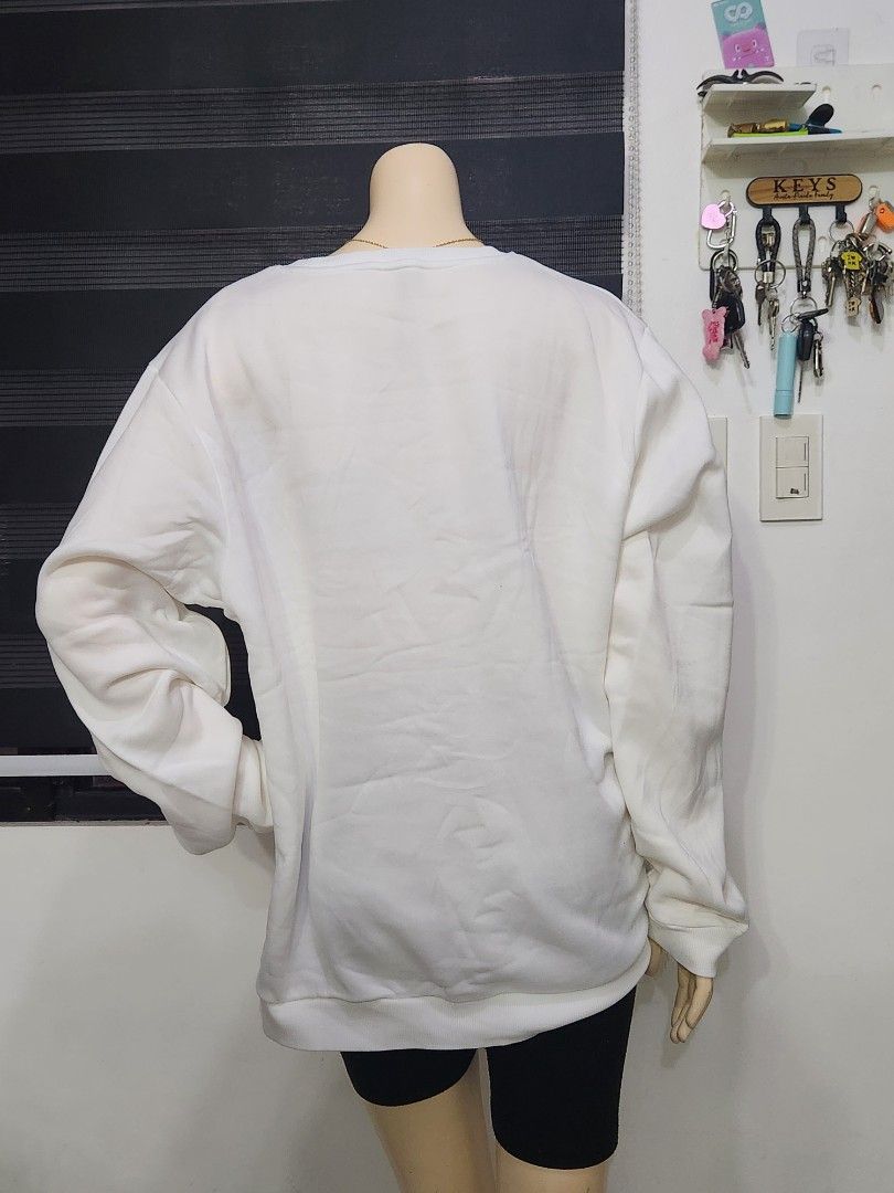 B-9 Classic White Crewneck Sweatshirt ✨ (Category: Coats, Jackets and Outerwear) located in Tanza. Submitted by wearitagainph (Listing ID 1471020226, Image 3). Description: Clean, minimal, and versatile! Features a classic crew neckline, ribbed cuffs and hem, and a comfy relaxed fit—a must-have essential for easy layering and everyday wear. * Bust: 48" * Length: 28" * Color: White * Condition: Excellent DM to order or inquire!.
