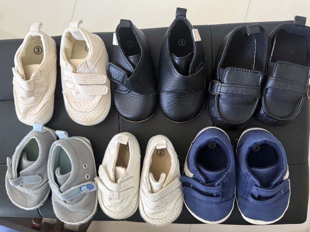Baby Shoes Bundle Infant Toddler Assorted Styles Sizes ♥️ (Category: Babies & Kids Fashion) located in Manila. Submitted by hotdealsph (Listing ID 1471006285, Image 1). Description: - Bundle of 6 pairs of stylish baby shoes - Sizes included: Size 2 and 3 - Variety of styles: Cream sneakers, black leather-look slip-ons, grey fabric shoes, white velcro trainers, and blue canvas shoes - Mix of strap closures and slip-on designs for easy wear - Clean