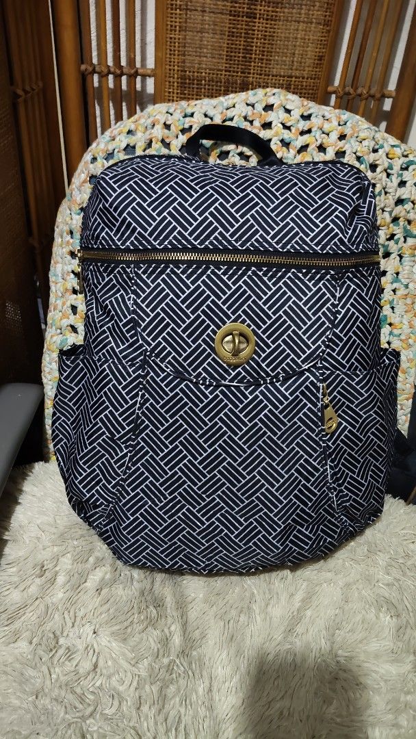 Baggallini Black and White Geometric Backpack (Category: Backpacks) located in Cebu City. Submitted by lumaynojes00490 (Listing ID 1470991233, Image 3). Description: - Brand: Baggallini - Design: Black and white woven pattern with chic gold-tone hardware - Material: Durable, travel-friendly nylon - Compartments: Zip-around top opening, front pocket with twist-lock closure, and dual side slip pockets - Comfort & Carry: Features a top grab handle a