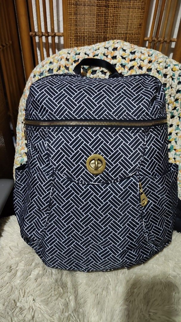 Baggallini Black and White Geometric Backpack (Category: Backpacks) located in Cebu City. Submitted by lumaynojes00490 (Listing ID 1470991233, Image 1). Description: - Brand: Baggallini - Design: Black and white woven pattern with chic gold-tone hardware - Material: Durable, travel-friendly nylon - Compartments: Zip-around top opening, front pocket with twist-lock closure, and dual side slip pockets - Comfort & Carry: Features a top grab handle a