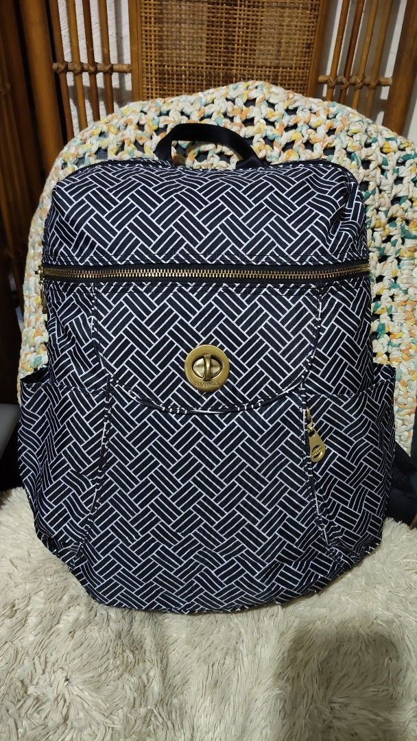 Baggallini Black and White Geometric Backpack (Category: Backpacks) located in Cebu City. Submitted by lumaynojes00490 (Listing ID 1470991233, Image 2). Description: - Brand: Baggallini - Design: Black and white woven pattern with chic gold-tone hardware - Material: Durable, travel-friendly nylon - Compartments: Zip-around top opening, front pocket with twist-lock closure, and dual side slip pockets - Comfort & Carry: Features a top grab handle a