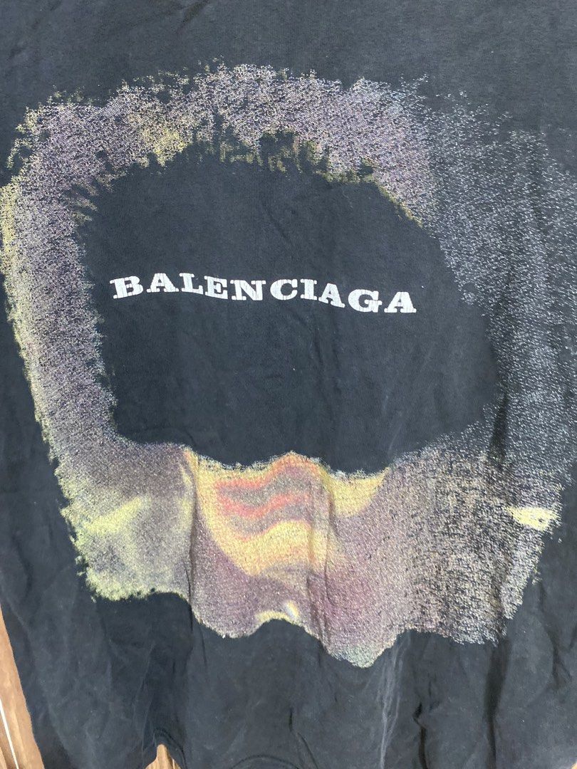 Balenciaga Black Graphic Tee (Category: Shirts) located in Caloocan City. Submitted by heatedcaps4425 (Listing ID 1471098799, Image 3). Description: - Brand: Balenciaga - Color: Washed black - Fit: Relaxed fit cotton tee - Design: Large abstract color gradient print with white Balenciaga chest logo - Details: Woven brand tag inside ribbed collar.