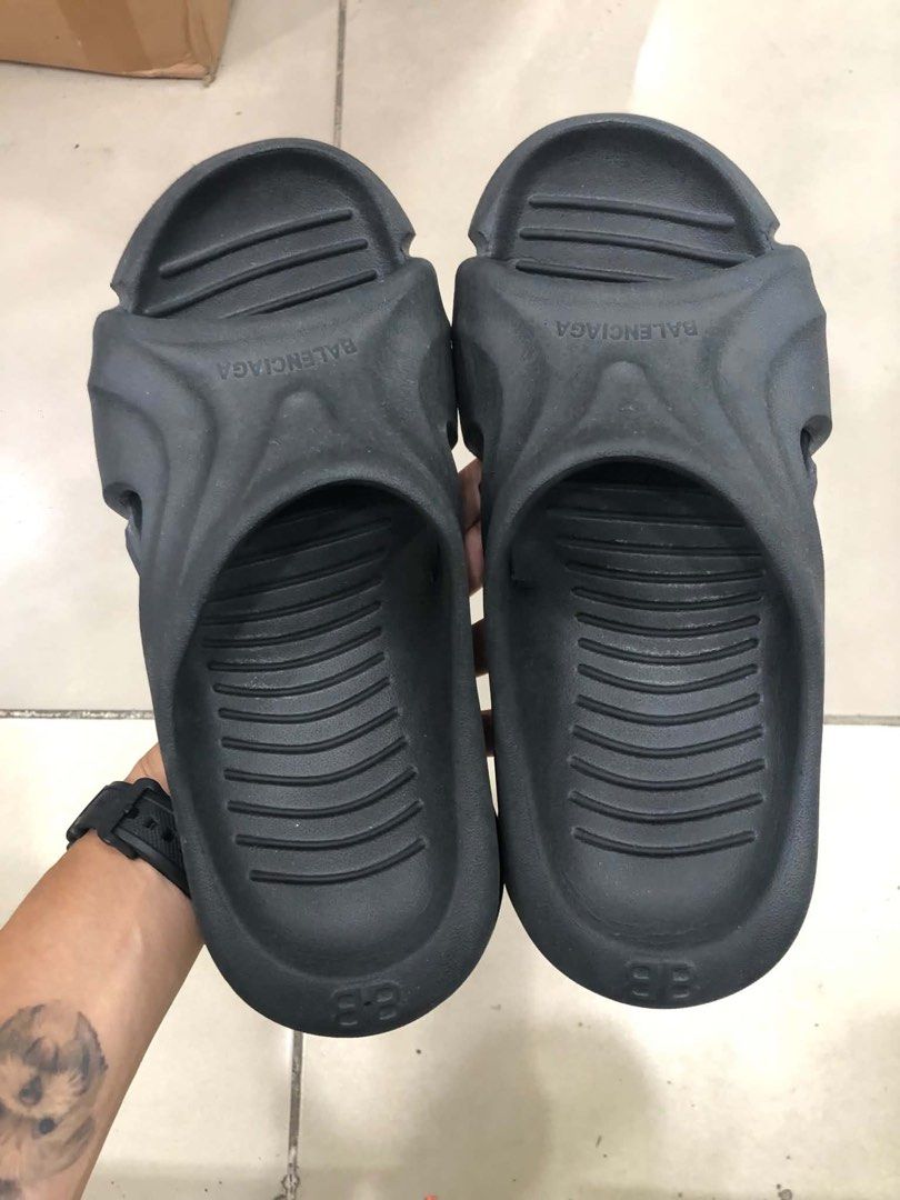 Balenciaga Cropped Runner Slides Black Size 38 (Category: Sneakers & Footwear) located in Bacolod City. Submitted by novymaesel14868 (Listing ID 1470999954, Image 2). Description: - Brand: Balenciaga - Item: Slide sandals - Color: Black - Size: 38 (marked on heel) - Material: Chunky molded foam with ribbed footbed - Details: Debossed logo on the strap - Condition: Clean, minimal wear on soles - Style: Easy slip-on for everyday streetwear.